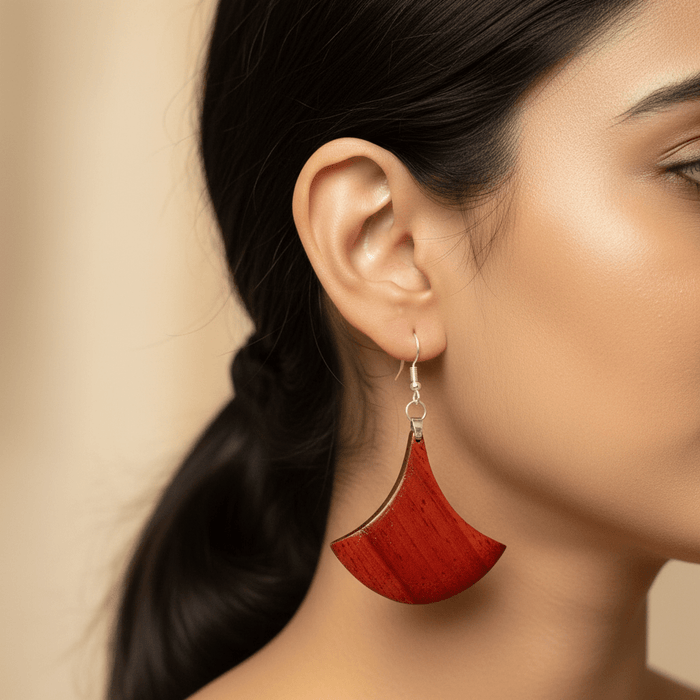 Aruna wooden earrings — a single piece of Padauk shaped into a flared fan