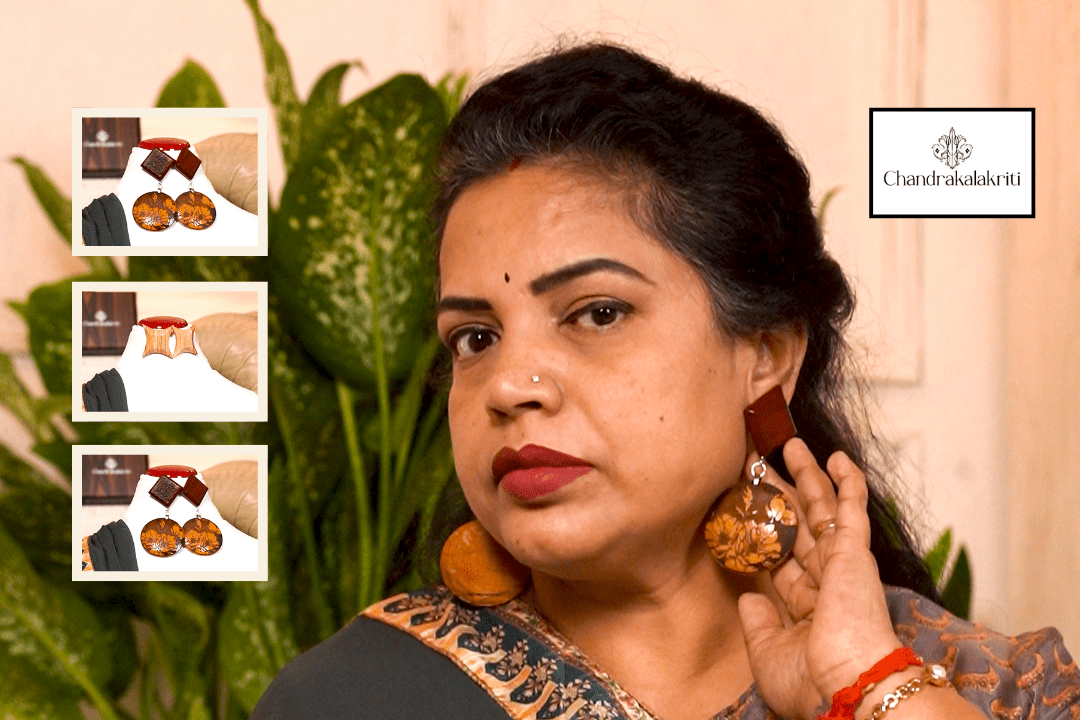 Wooden earrings worn with a saree, showing the natural grain against the fabric