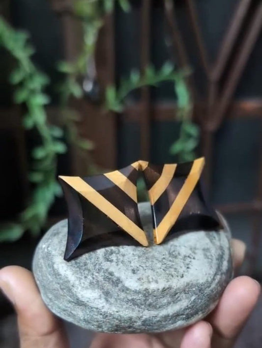 Jaya wooden stud earrings in Ebony banded with Boxwood, worn for Bengali New Year