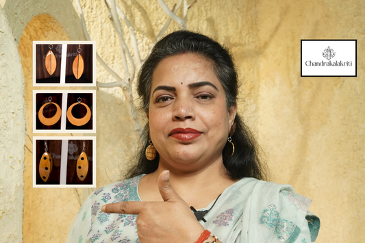  Flat lay of wooden earrings with leaves and natural textures showcasing eco-friendly fashion