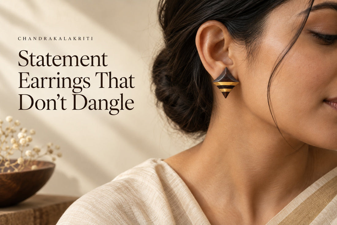 Ebony and Boxwood diamond stud earrings worn with a cream saree